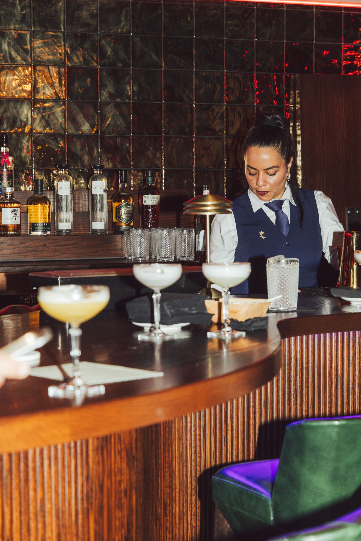 A bartender building a drink at Sub-Mission, the hidden cocktail lounge in Union Square, New York