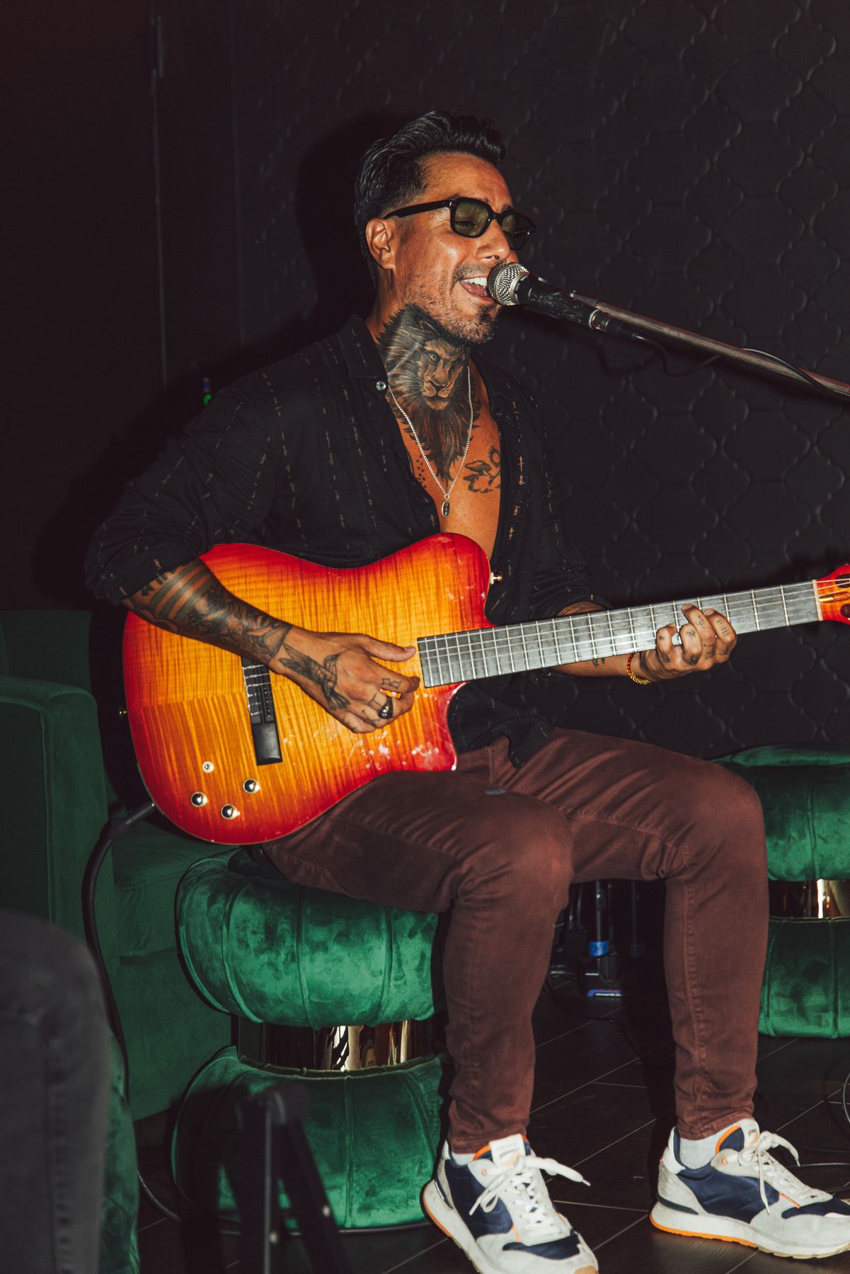 A guitarist playing live playing to the room at Sub-Mission, beneath Mission Ceviche