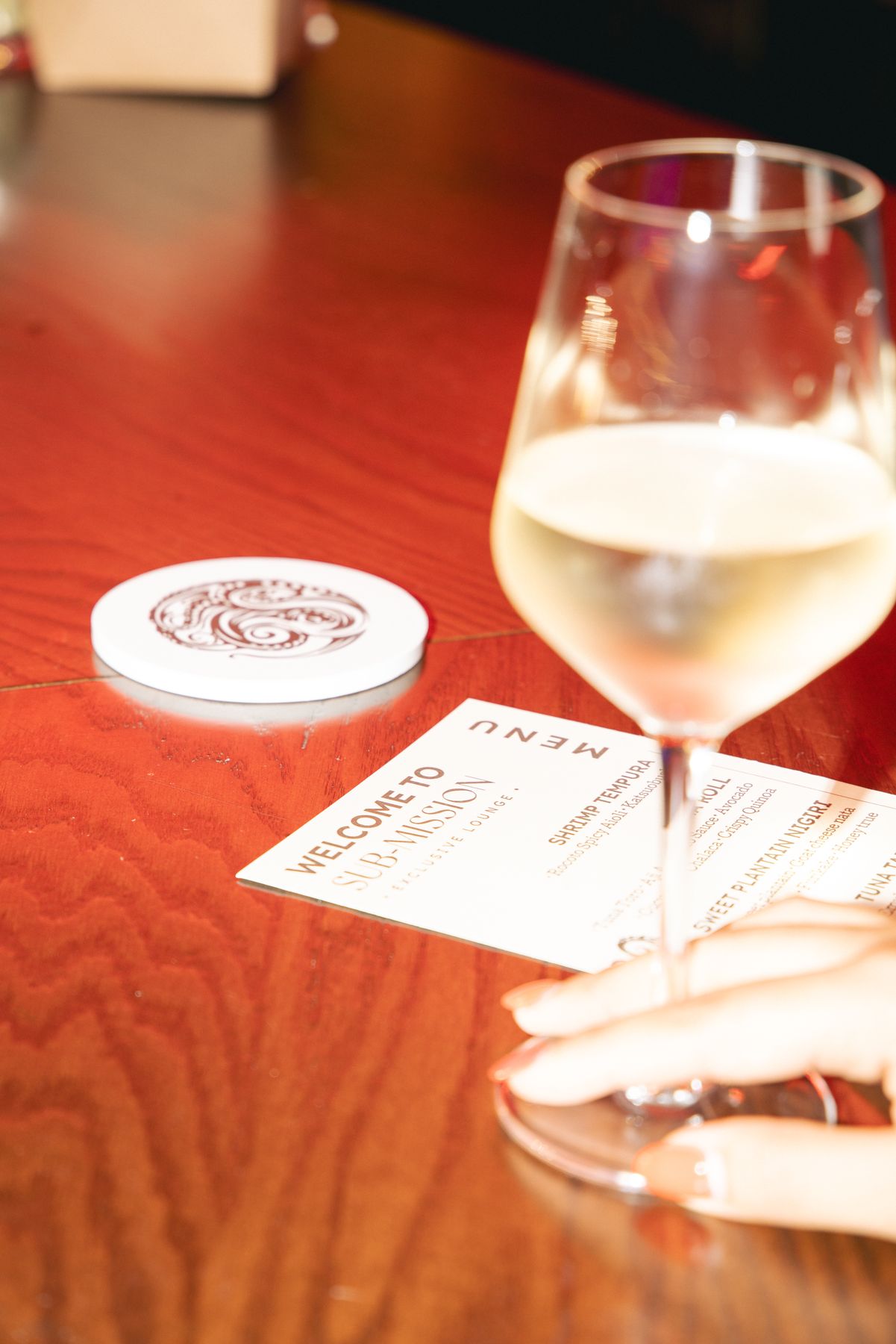 A glass of wine on the signature list at Sub-Mission, Union Square